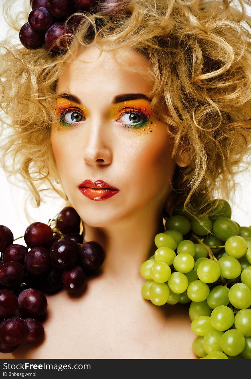 Beautiful young woman portrait excited smile with fantasy art hairstyle with grapes