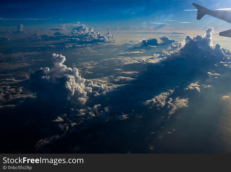 View The Sunrise And Clouds From The Flight Window