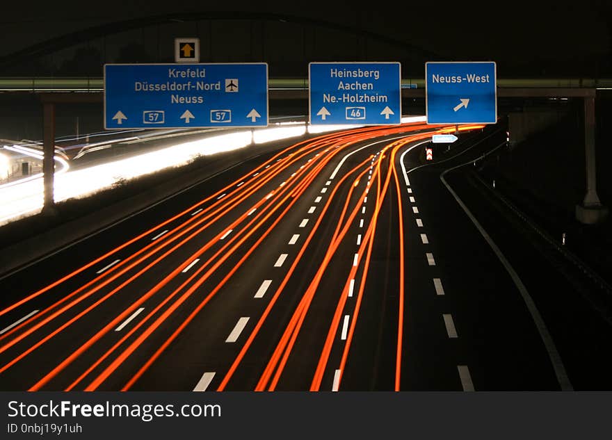 Germany - Highway A57 - motorway junction Neuss-West at night with fast cars in long exposure