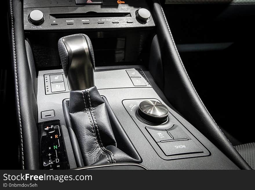 Gear shift in the middle console of a modern car. Gear shift in the middle console of a modern car