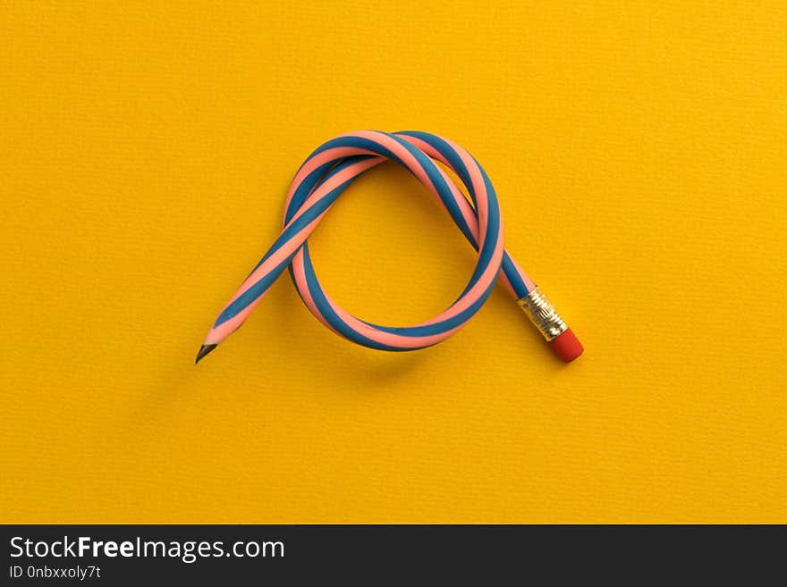 Flexible pencil . Isolated on light background. Bending pencil.