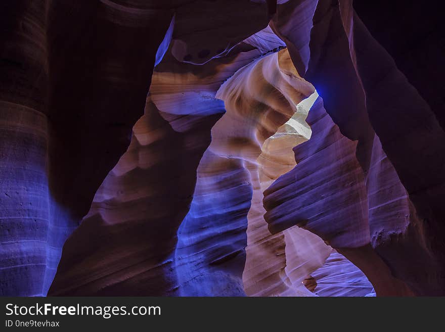 Colorful curved blue and purple walls in Lower Antelope Canyon in the Navajo Reservation near Page, Arizona, USA. Colorful curved blue and purple walls in Lower Antelope Canyon in the Navajo Reservation near Page, Arizona, USA.