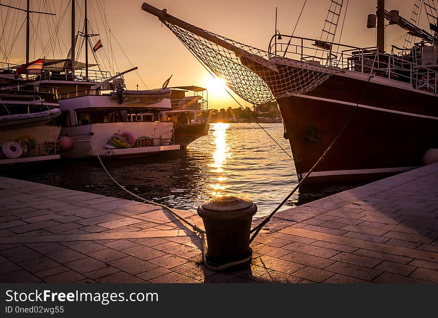 Golden sunset in dalmatian Makarska harbour in Croatia. Golden sunset in dalmatian Makarska harbour in Croatia