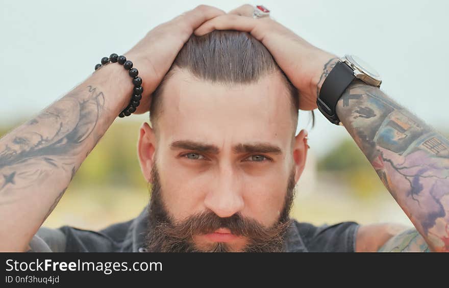 Portrait of a close-up of a brutal bearded man.