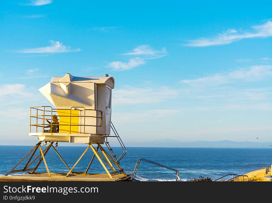 Girls in a lifeguard hut in La Jolla beach, San Diego. Southern California, USA