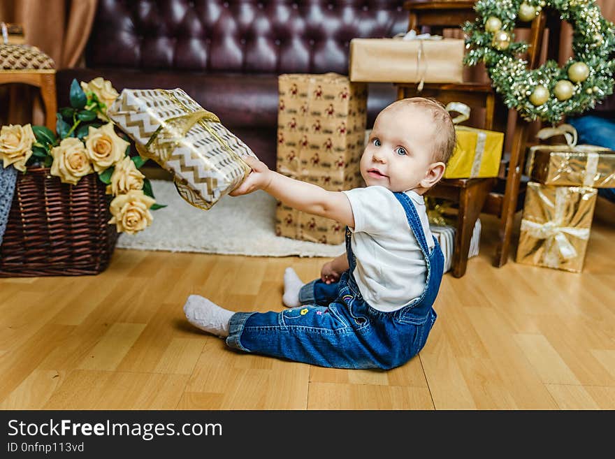 Little Girl Playing With Christmas Gifts