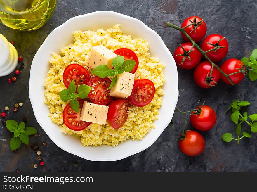 Millet porridge with tomatoes and cheese