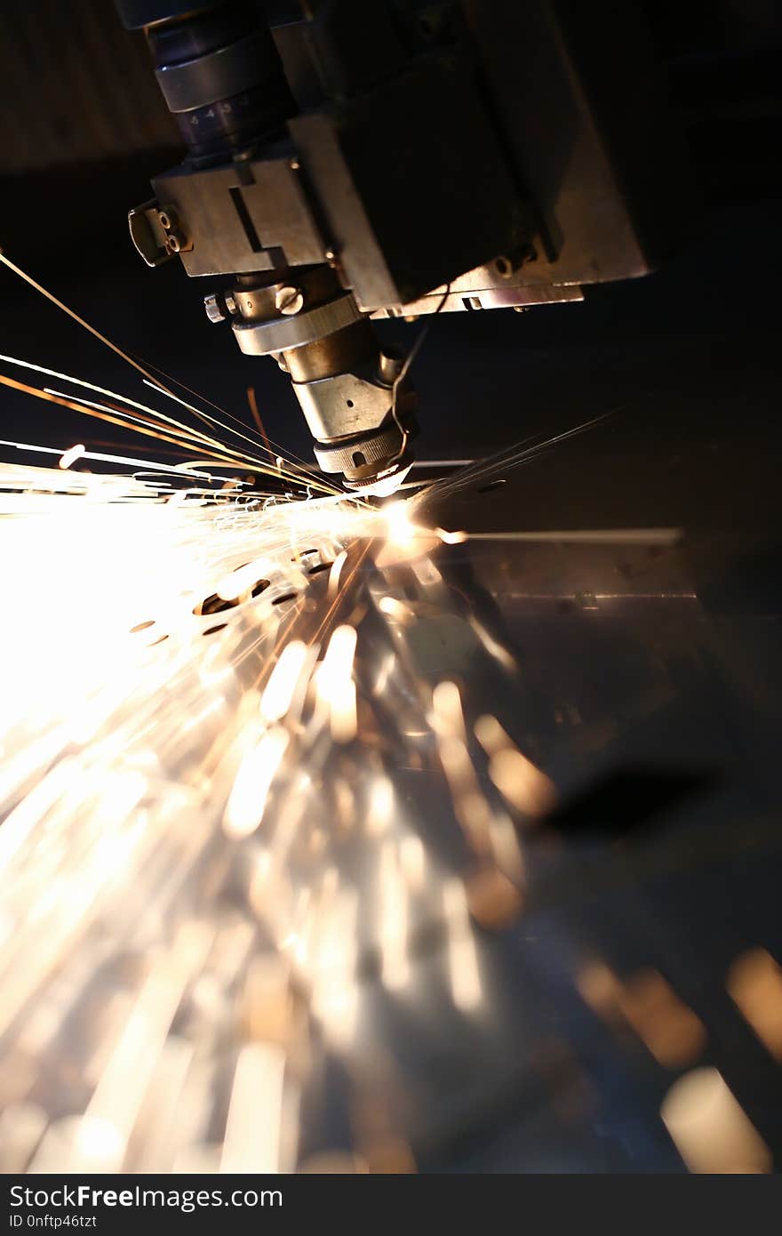 Sparks fly out machine head for metal processing