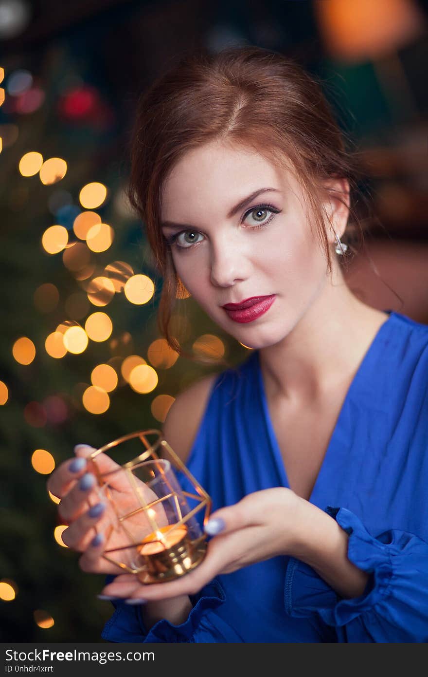 Beautiful young woman celebrating christmas