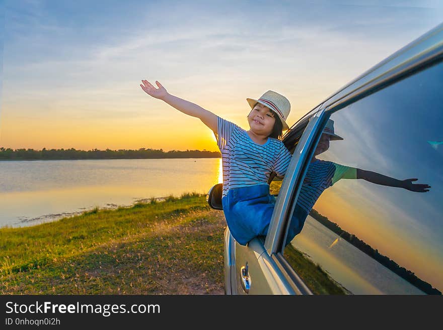 Childern are playing on the lake at sunset. People have fun on the field. People have fun on the field. Family Friendly Concept and Summer Vacation.