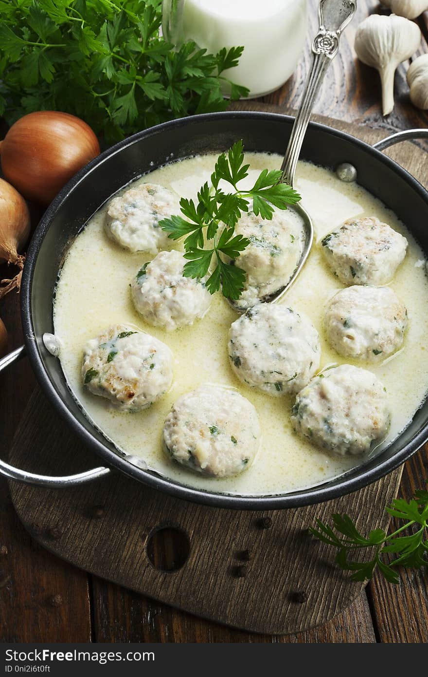 Chicken meatballs in milk sauce on the table