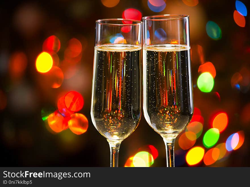 Champagne Glasses And Christmas Lights