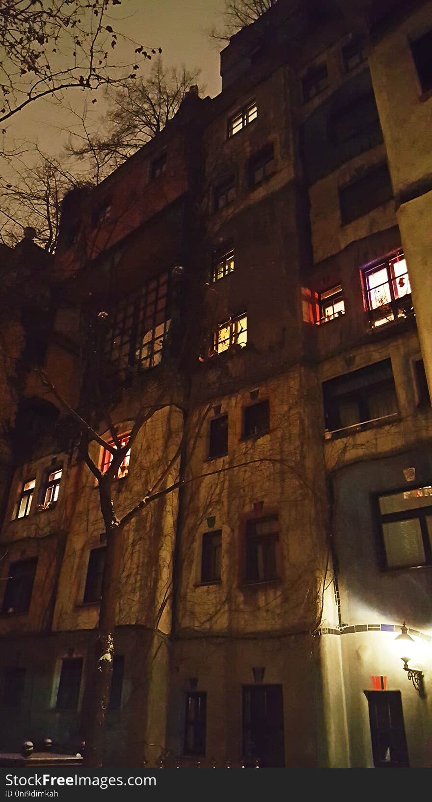 Hundertwasserhaus buildings designed by austrian architect Friedensreich Hundertwasser in Vienna at night in winter time