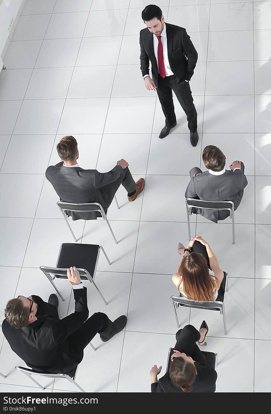 Top view of the company`s shareholders at a meeting. Top view of the company`s shareholders at a meeting