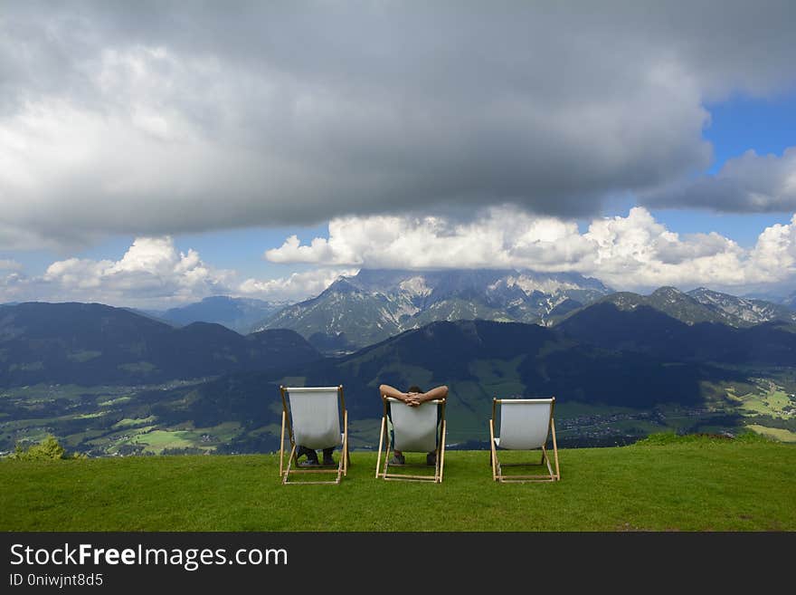 Beautiful view from Henne mountain in Austrian Alps and lounge chairs at Larchfilzkogelof gondola lift station nature reserve place in Alps, Fieberbrunn, Austria. Beautiful view from Henne mountain in Austrian Alps and lounge chairs at Larchfilzkogelof gondola lift station nature reserve place in Alps, Fieberbrunn, Austria