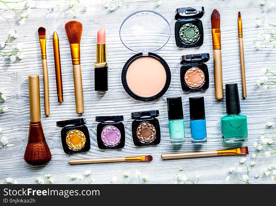 Make up set with decorative cosmetics on woman table background