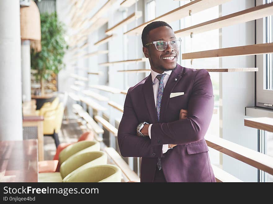 Happy smile of a successful African American businessman in a suit