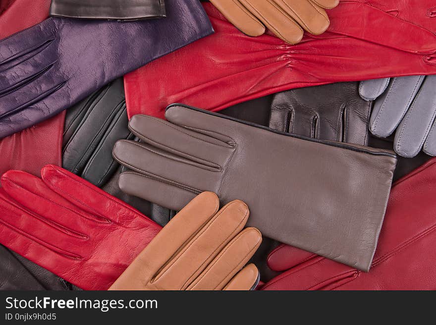 Scattered Colored Gloves. Leather Gloves Close Up