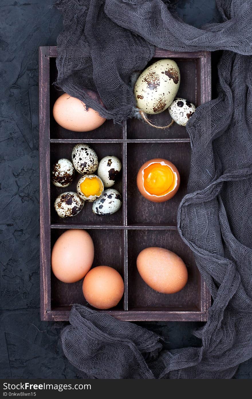 Easter colorful eggs in decorative wooden box, top view with copy space. Easter colorful eggs in decorative wooden box, top view with copy space