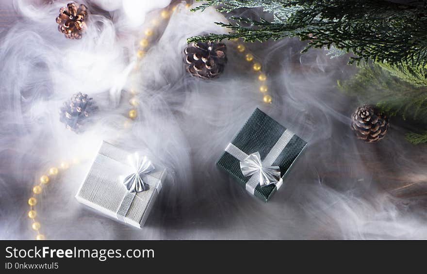 New Year&#x27;s background with gifts, conifer branches