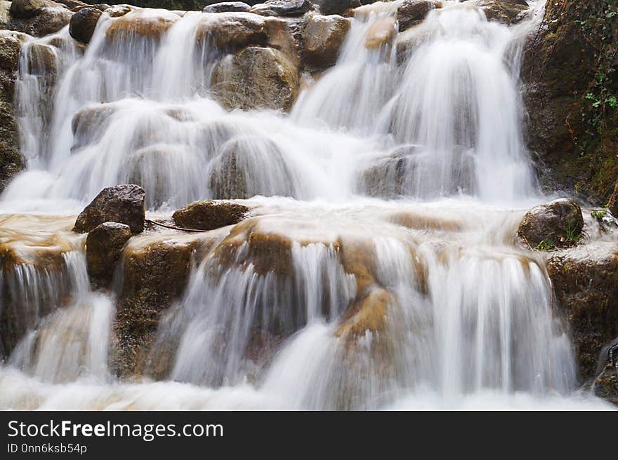 Waterfall photography with long time exposure making foggy landscape out of flowing water. Waterfall photography with long time exposure making foggy landscape out of flowing water