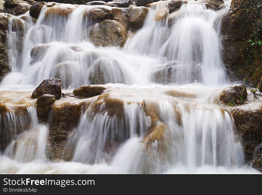 Amazing waterfall like fog around stones