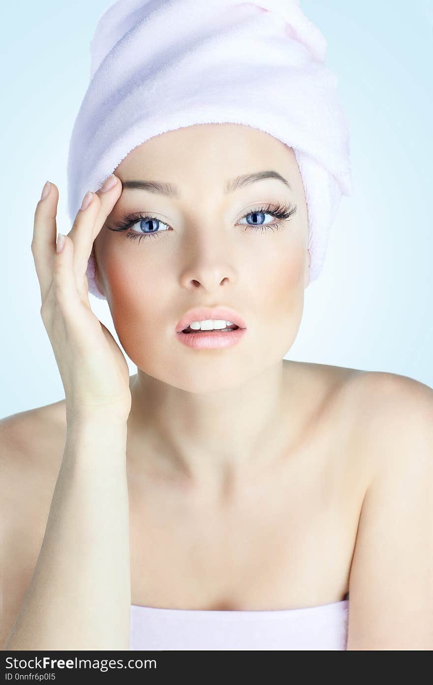 Woman after shower looking at herself in the mirror. Woman after shower looking at herself in the mirror