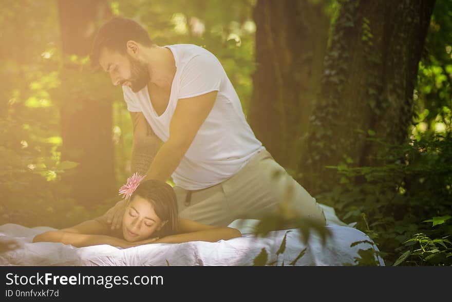 Enjoying a great massage. Men gives massage to a women