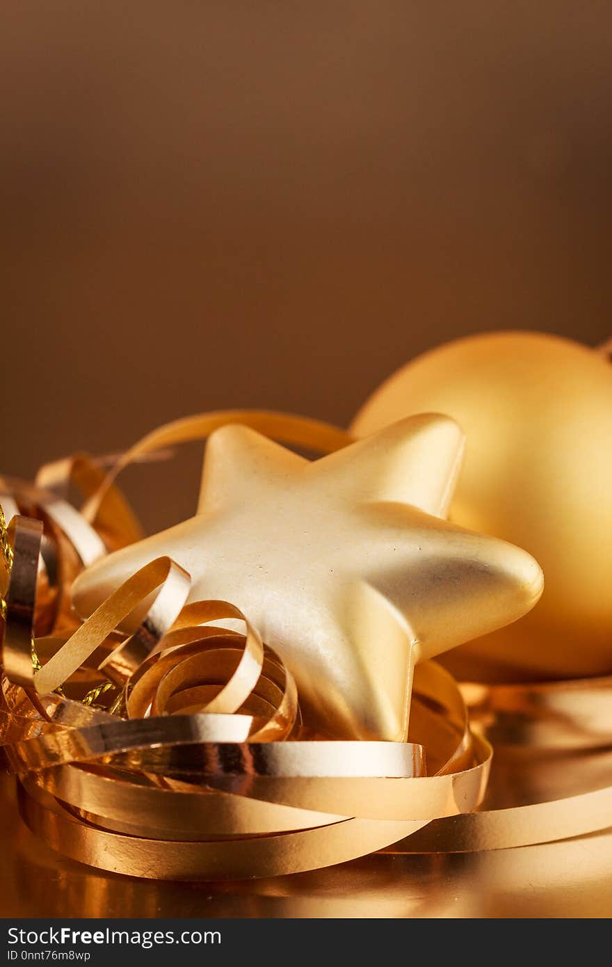 Christmas composition of Christmas tree toys on a blurred gold background