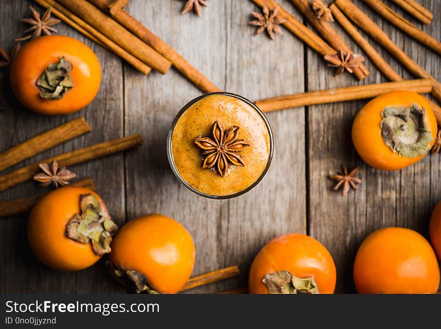 Fresh persimmon fruit on wooden table