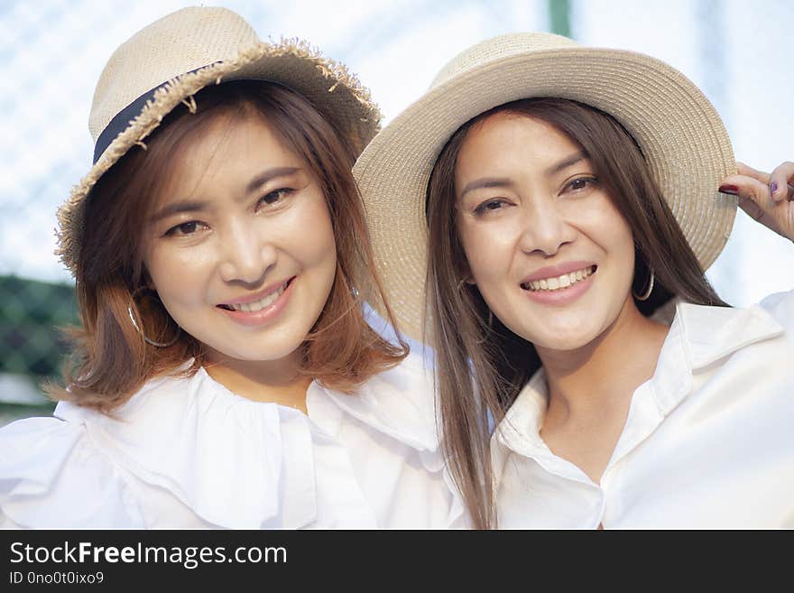 Close up face of toothy smiling face asian younger woman vacatio