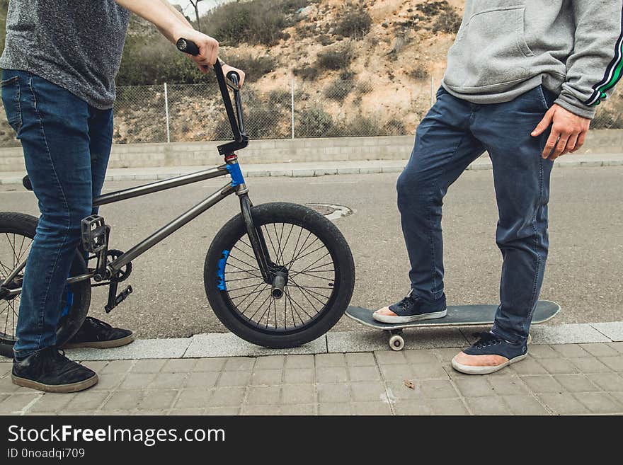 Young people with skateboard and bmx bike. Extreme urban sports concept