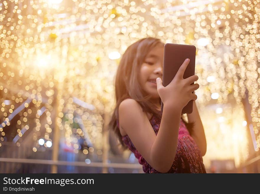 Asian kids selfie live chat with mobile phone