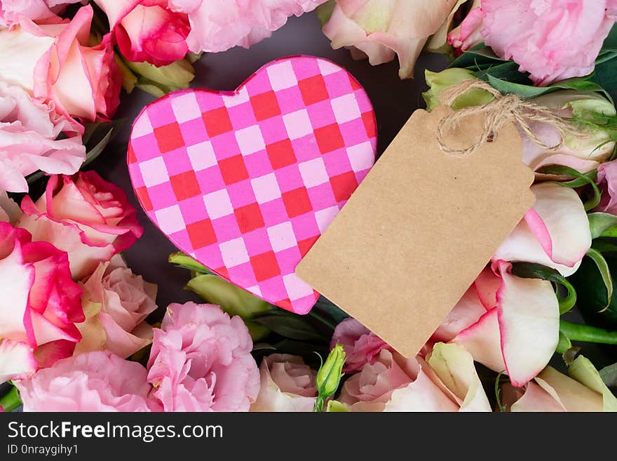 Rose fresh flowers bouquet on gray table from above with gift box and paper note, flat lay scene with copy space. Rose fresh flowers bouquet on gray table from above with gift box and paper note, flat lay scene with copy space