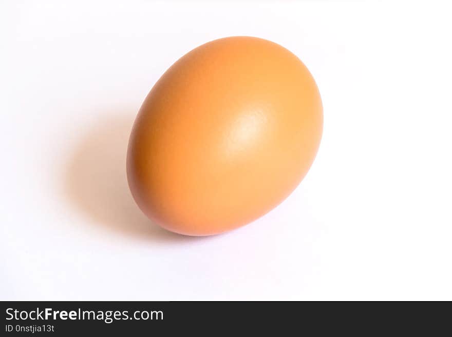 Image of one brown chicken egg in white background. Image of one brown chicken egg in white background.