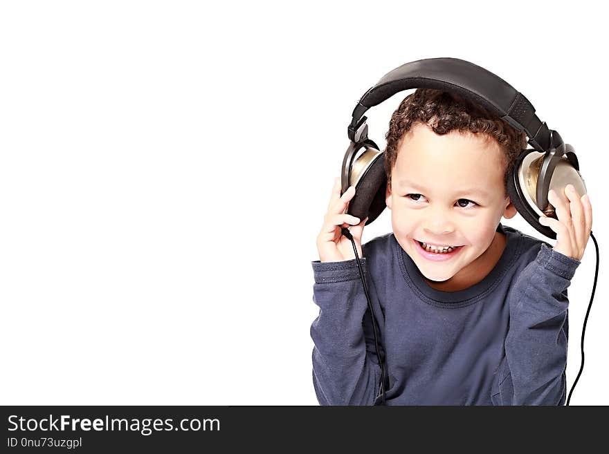 Little s boy with headphone enjoying disco  music with white background