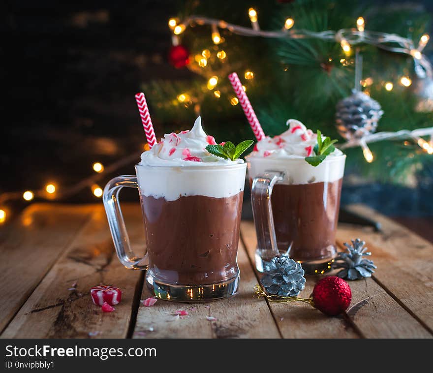 Christmas mint hot chocolate in glass on wooden background. Christmas mint hot chocolate in glass on wooden background.