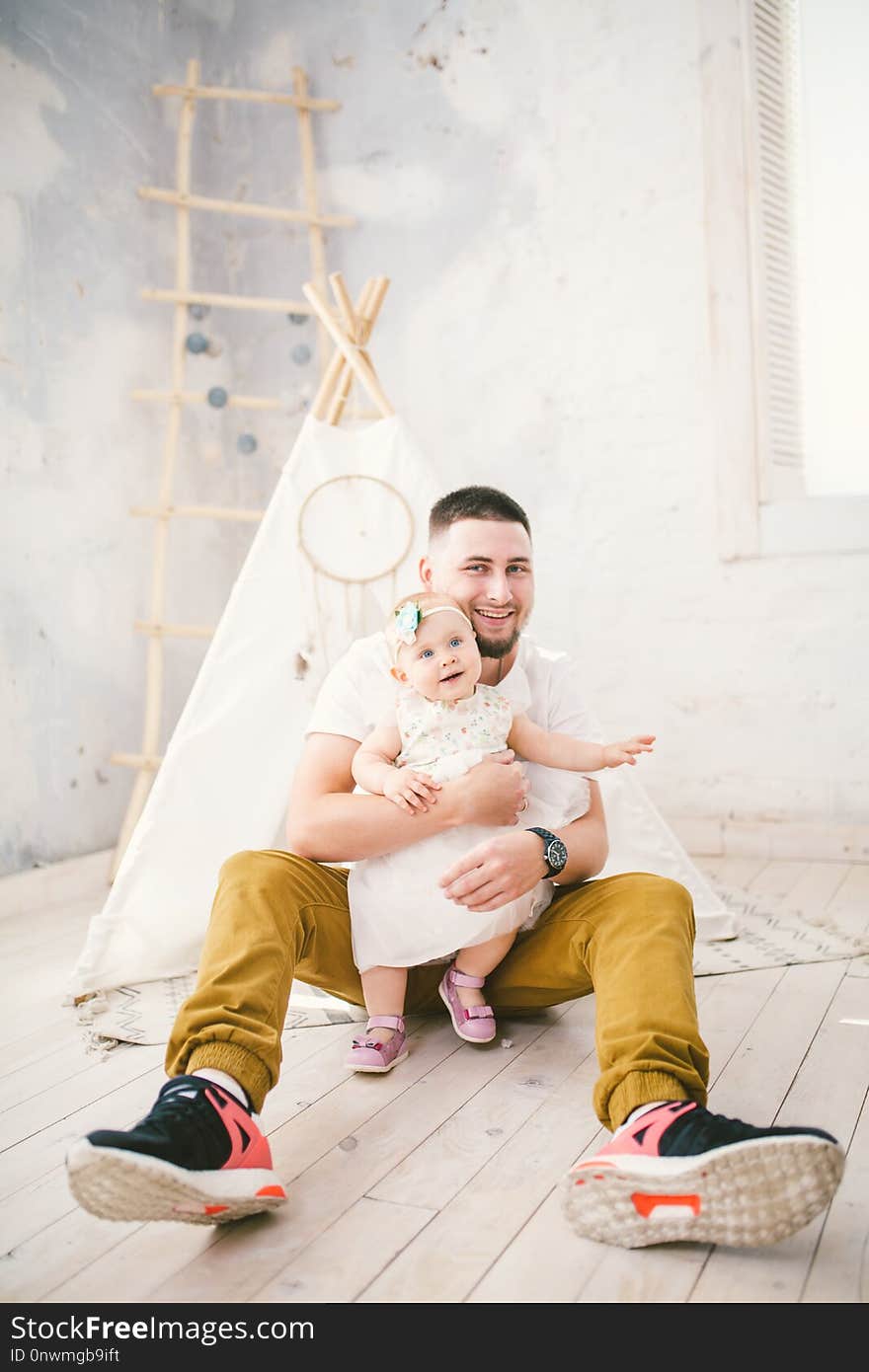 Father and daughter playing at home