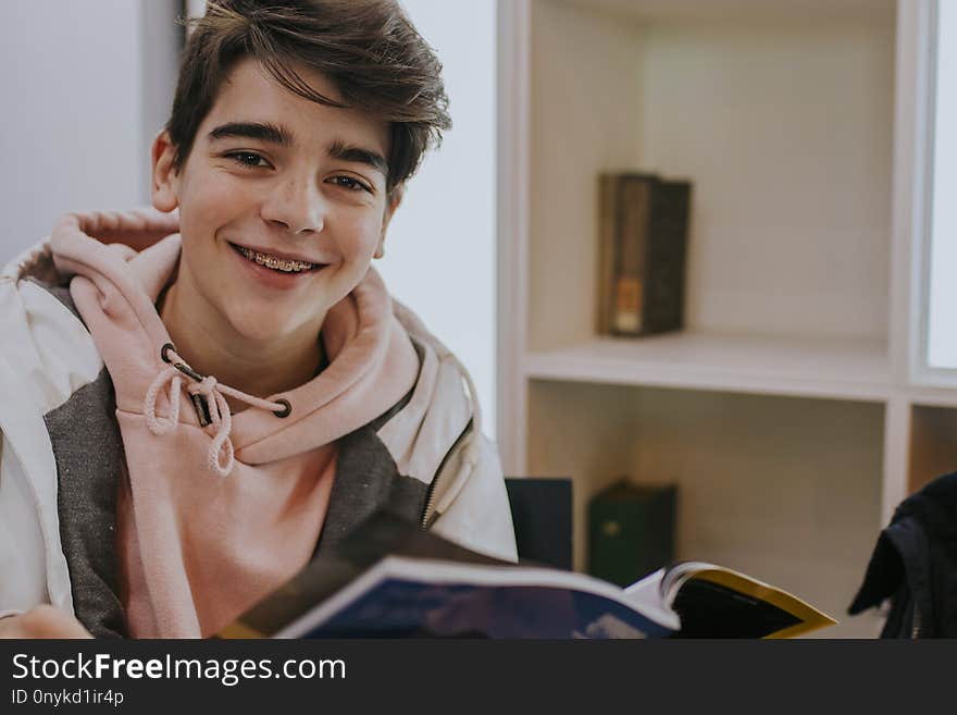 Young teenager reading the book