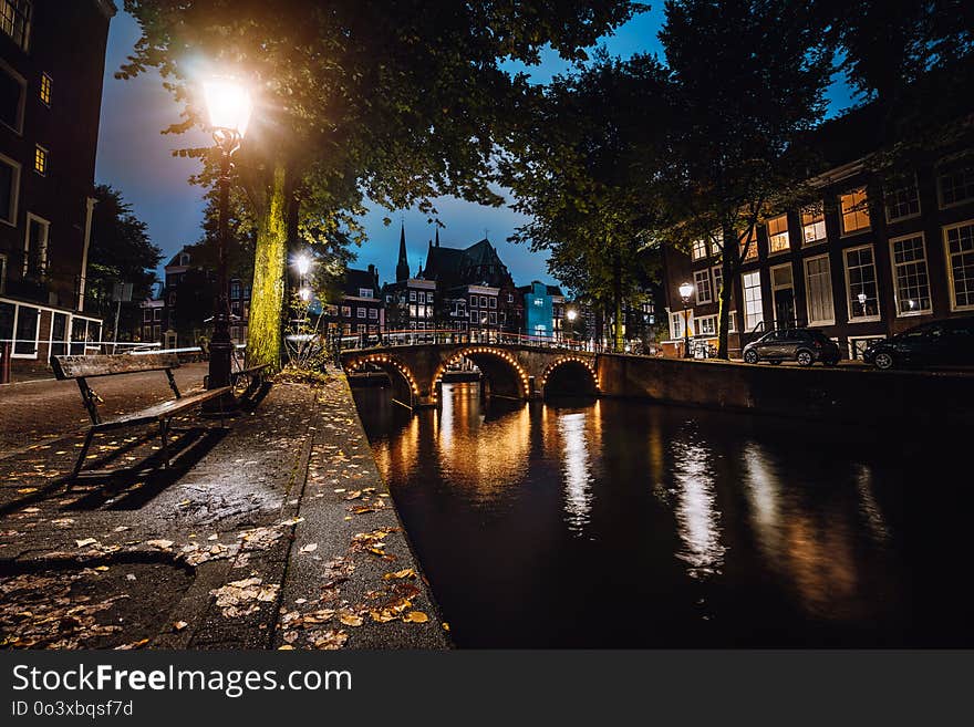 Tranquil scene of Amsterdam, autumn cityscape of beautiful bridge over canal. the Netherlands. Long exposure.