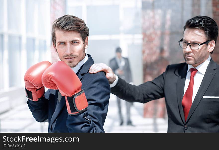 Lawyer in Boxing gloves and his supervisor. the concept of business competition