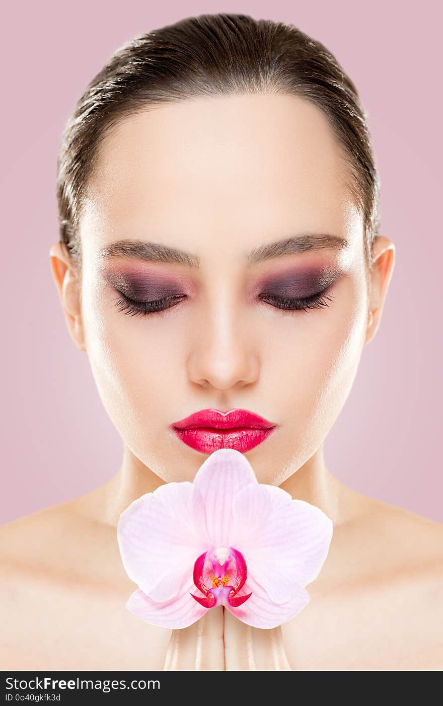 Portrait of a brunette makeup beauty with dark eye shade