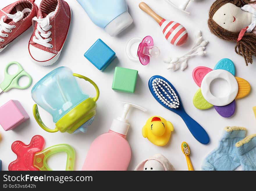 Flat lay composition with baby accessories on white