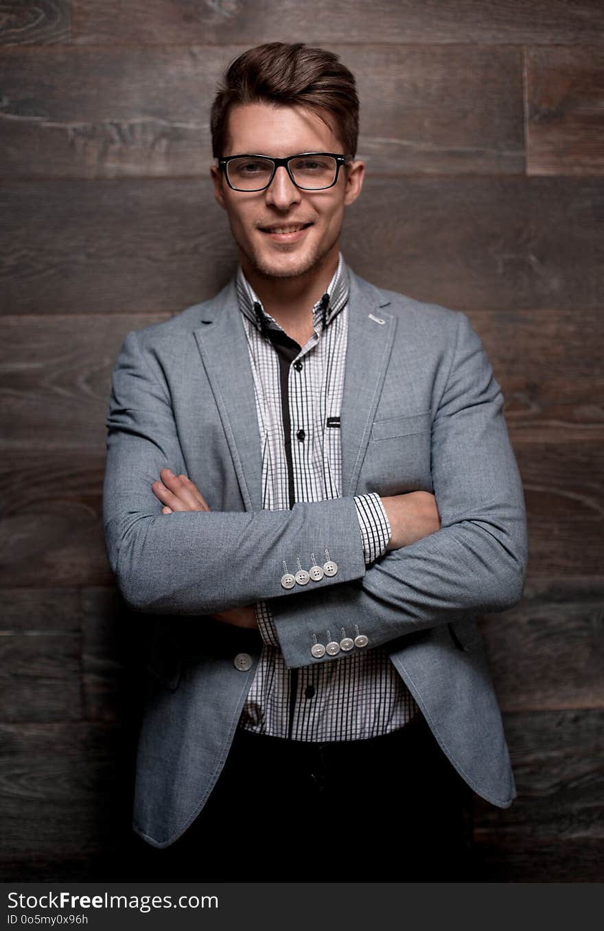 Attractive Young Businessman Standing Looking At The Camera