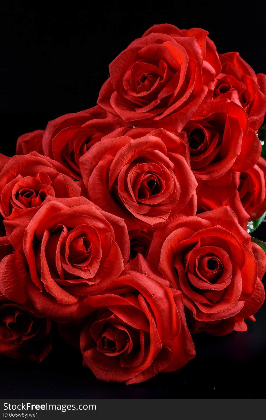 Bouquet of red roses on black background. St Valentine`s concept