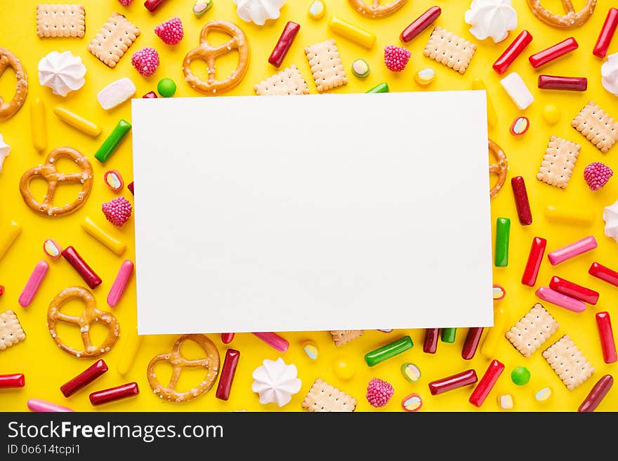 Flat Lay of Tasty Colorful Sweets on Yellow Background. Party Happy Birthday Concept. Copy space. Flat Lay of Tasty Colorful Sweets on Yellow Background. Party Happy Birthday Concept. Copy space