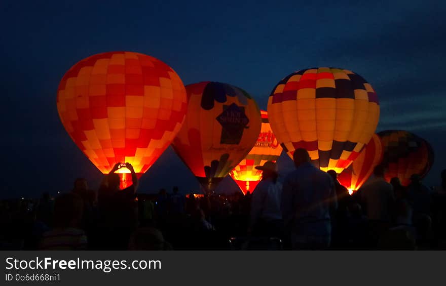 Hot air balloons lighting up the fire and