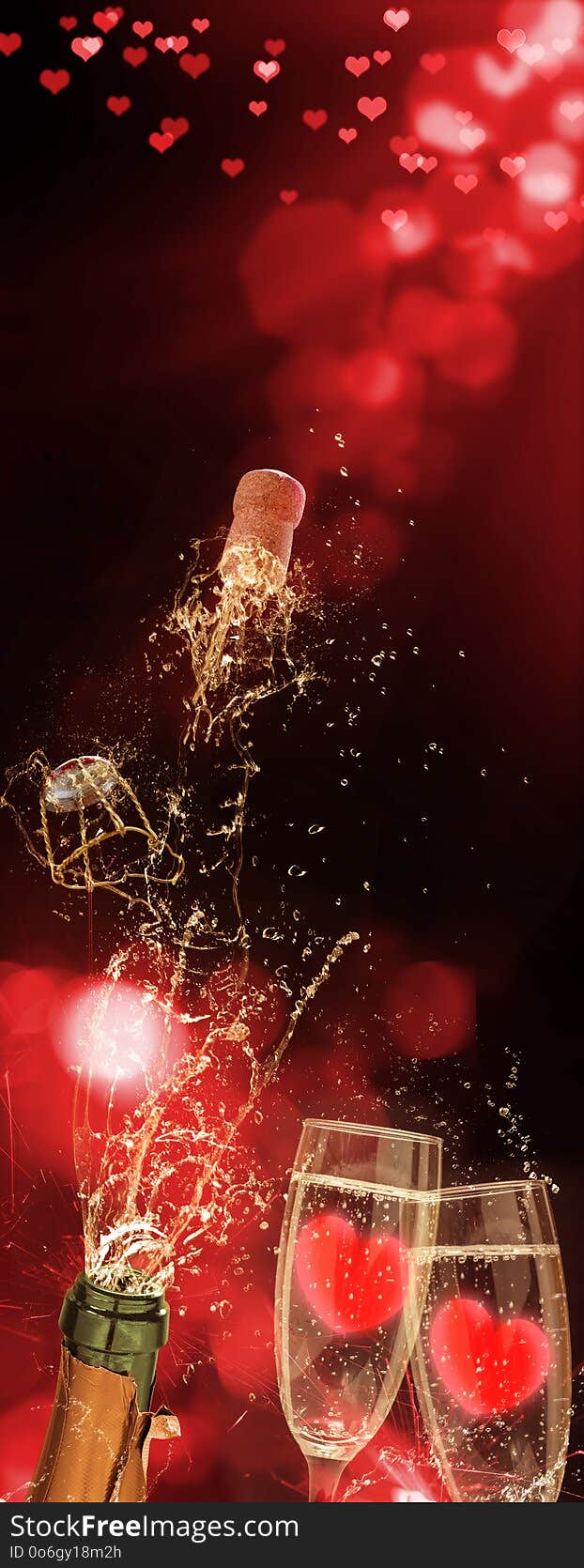 Sparkling wine squirts out of the bottle, hearts in the glasses, Valentine`s Day