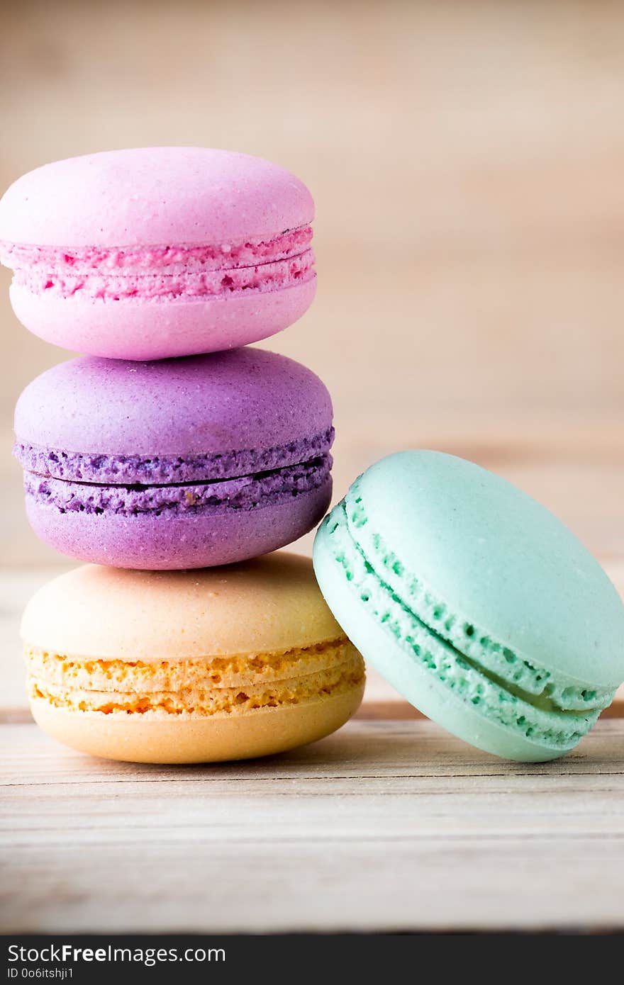 Macaroons and the table. Dessert background. Studio shoot