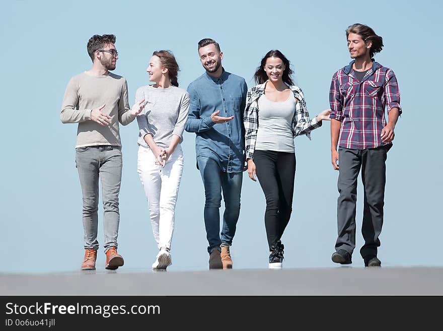 Team of friends, walks on the road